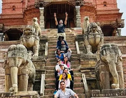 A fun group photo on the steps of a temple in Bhaktapur, guarded by ancient stone lions and elephants. These journeys are filled with learning, laughter, and lasting memories.