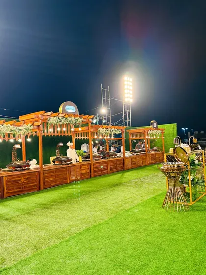 A wide shot of the dedicated Mutton Mandi station, set up under a charming wooden pergola.