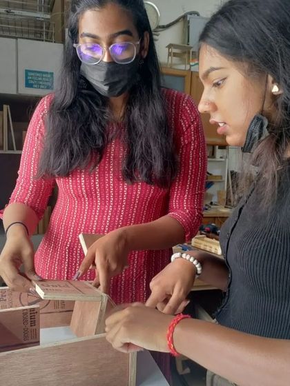 Teamwork makes the dream work. Students help each other with measurements and assembly, learning from one another in the process.