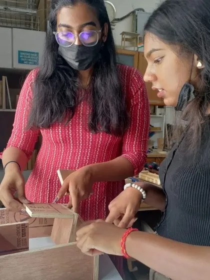 Teamwork makes the dream work. Students help each other with measurements and assembly, learning from one another in the process.