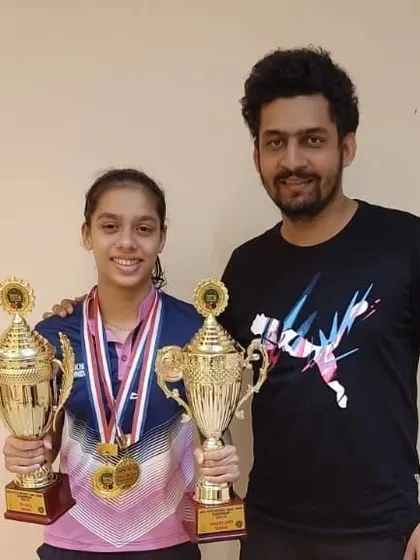 Me with Ananya Chande after she won a double crown in the U-17 and Women's categories at the JVPG district tournament. A perfect performance.