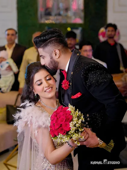 A tender forehead kiss, a moment of quiet affection amidst the celebration. These are the heartfelt interactions I seek out, the small gestures that speak volumes about a couple's bond and become cherished memories.