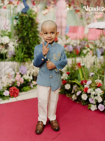 Ready for the red carpet in a beautiful blue bandhgala set. This outfit is perfect for formal events, with its sharp tailoring and subtle embroidery making your little one look dapper and poised.