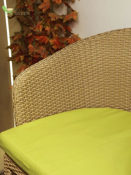 A close-up of the comfortable, water-repellent cushion on our wicker bar chair. The vibrant color and quality fabric are key details that elevate the overall design.