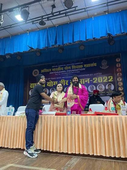 One of our senior instructors being honored on stage. We believe in continuous learning and sharing our knowledge with the community.