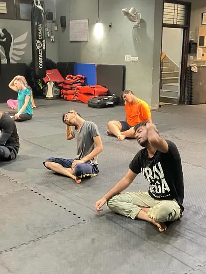 Neck stretches are crucial for relieving tension and maintaining mobility, which is vital for awareness and avoiding injury during grappling or striking.