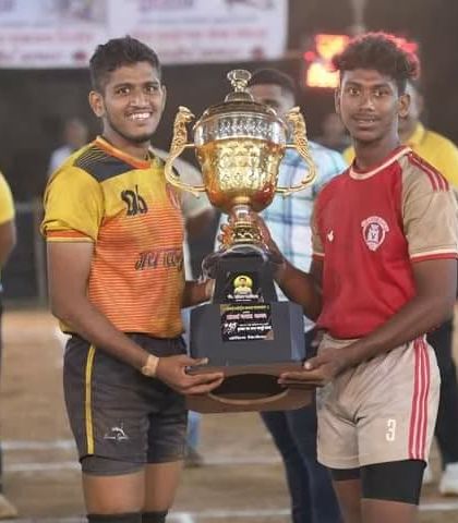 The captains of the two finalist teams with the trophy before the final match at the Samarth Sports Club tournament.