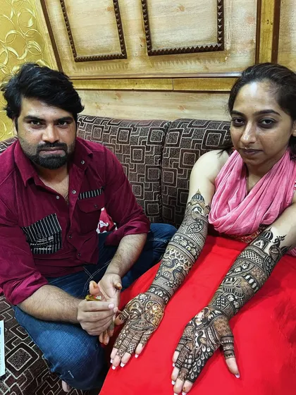 This client chose a very detailed and dense pattern for her full-arm mehandi. Our team has the skill and patience to execute such complex requests.