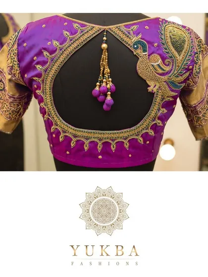 Another take on the beloved peacock motif, this design combines it with a modern circular cutout. The rich purple silk is the perfect canvas for the intricate gold zardosi work, creating a piece that feels both regal and contemporary.