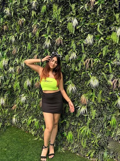 Adding sunglasses to the party look for a cool, edgy vibe. This shows how accessories can transform an outfit.