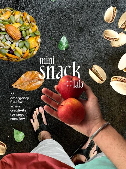 A 'mini snack lab' flatlay of on the go snacks. This creative product shot uses natural elements and a unique layout to make everyday items look like a curated collection.