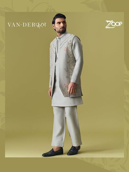 A full view of a nature-inspired look from the Vanderphool collection. This grey layered kurta set with subtle floral embroidery is perfect for the man who appreciates understated elegance.