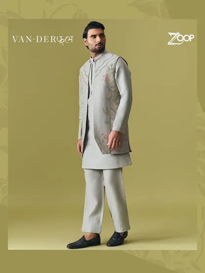 A sophisticated grey layered kurta set from the Vanderphool collection. The subtle floral embroidery on the jacket adds a touch of artistry to the monochromatic look.
