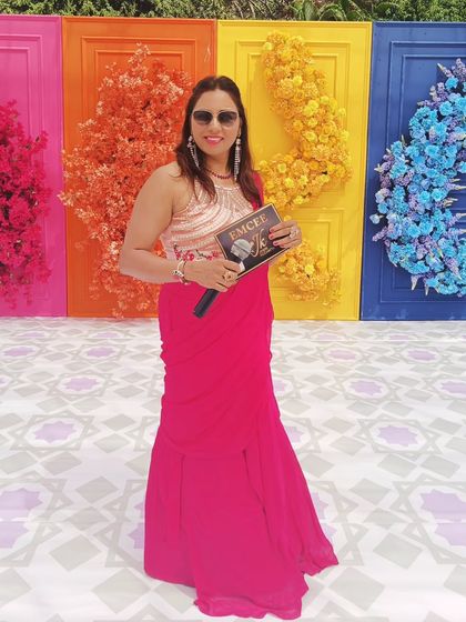 Holding my custom mic plate, ready to host. This little detail is a part of my professional branding as Emcee JK.