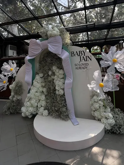 A wider shot of the giant bow backdrop, showing its scale and how it creates a stunning focal point in the venue.