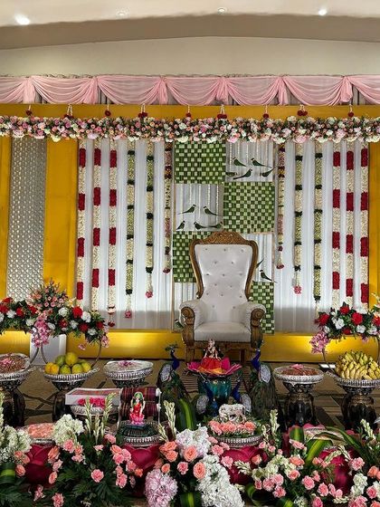 A full view of the puberty ceremony stage with a complete offering table.