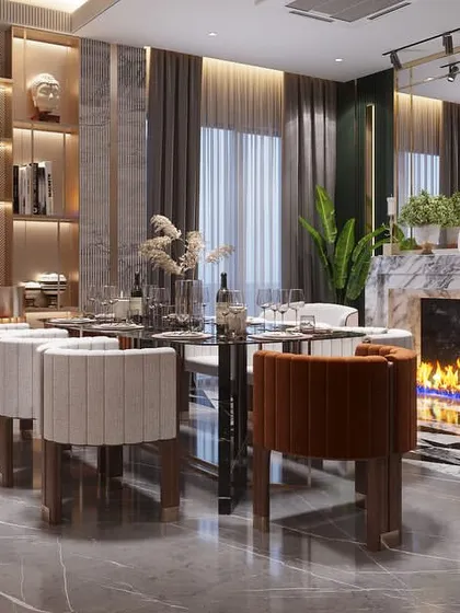 I design spaces for living. This view shows a seamless blend of the dining area, a fully stocked bar, and a cozy fireplace, creating the perfect atmosphere for entertaining guests or enjoying a quiet evening at home.