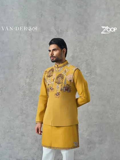 This vibrant yellow kurta set features intricate embroidery depicting traditional motifs and nature. It's a perfect example of how the Vanderphool collection harmonizes tradition with the beauty of the natural world.