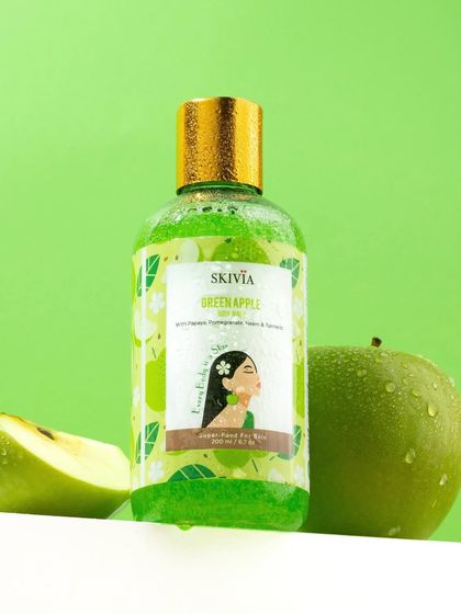 Fresh and crisp. This shot for a green apple body wash uses a bright green background and a real, water-speckled apple to create a mouth-watering and refreshing image.