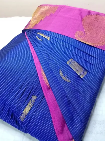 A blue and pink striped silk saree.