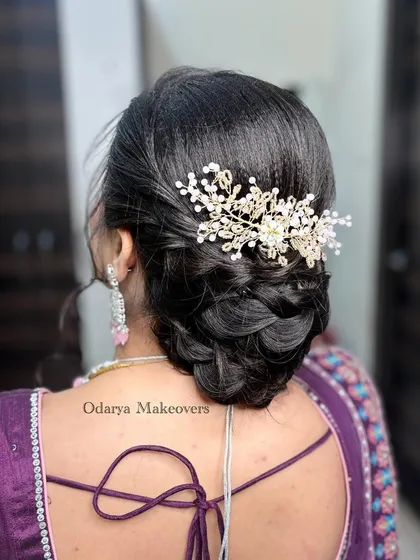 A clean, polished view of the trending braided bun. This hairstyle is perfect for keeping your hair neatly in place while still looking incredibly stylish and detailed.