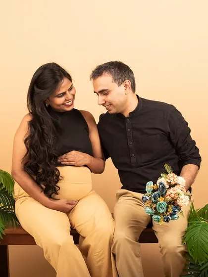 Maternity sessions are a beautiful way to capture the love between partners before the baby arrives. This studio portrait focuses on the quiet, intimate connection and shared excitement of the parents-to-be.