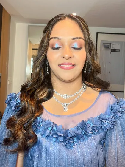 A close-up of the holographic eye makeup. The blue and purple shifts in the eyeshadow create a mesmerizing, multi-dimensional effect that is perfect for a party.