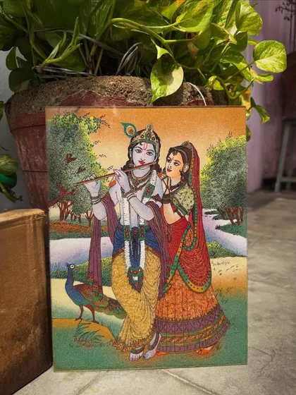 The eternal love between Radha and Krishna is brought to life with shimmering gemstones. This piece is designed to radiate harmony and devotion, making it a perfect centerpiece for a living room or a sacred addition to your pooja space.