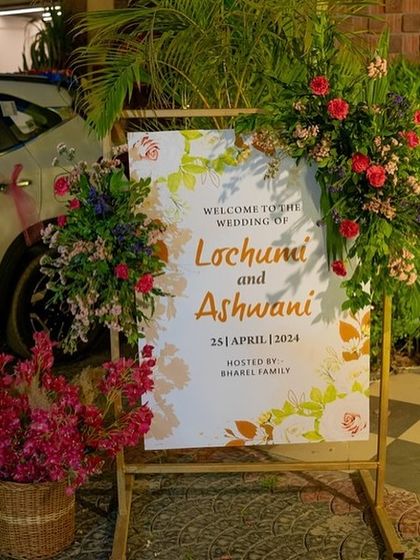 A beautiful welcome to the wedding of Lochuni and Ashwani. I designed this custom welcome sign with a delicate floral motif and framed it with lush, real flower arrangements to greet guests with style.