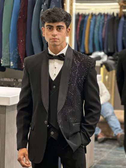 A direct shot of the asymmetrical tuxedo, highlighting the unique design and confident style.