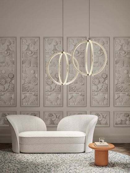 The Luminora Light by Cristina Celestino for Moooi, seen here as a pair of pendants. Their design, inspired by the Golden Ratio, blends geometric precision with nostalgic aesthetics.