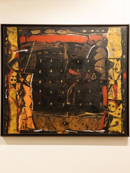 An untitled abstract work by Achutan Kudallur, where dramatic black, ochre, and sienna tones create a mysterious and intense composition reminiscent of cave etchings.