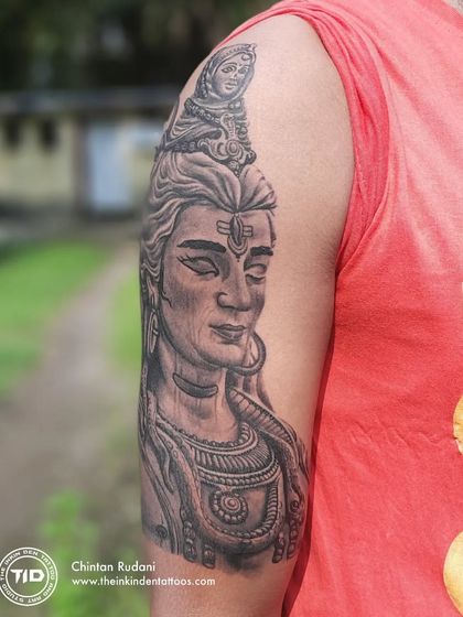 A side view of the realistic Adiyogi Shiva portrait tattoo.