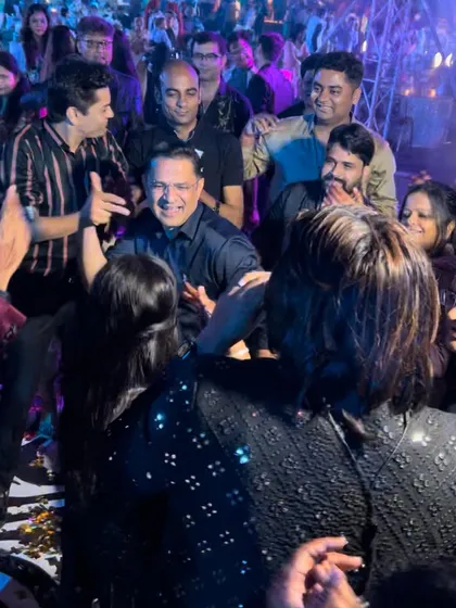 This photo captures the pure joy and connection we share with our audience. We often step off the stage to sing and dance right alongside the guests, making it a truly interactive experience.