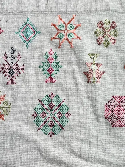 A sampler of various Kasuti motifs. I often create these to explore new color combinations and patterns. Each small design is a testament to the versatility of this counted-thread technique.