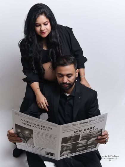 We had so much fun with this creative newspaper prop announcing the baby's arrival. It adds a unique and playful touch to the maternity session, showing the couple's personality and excitement.