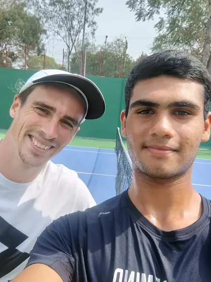 A selfie of our junior player Yashvardhan with Geoffrey Blancaneaux, capturing a memorable interaction with a top professional.