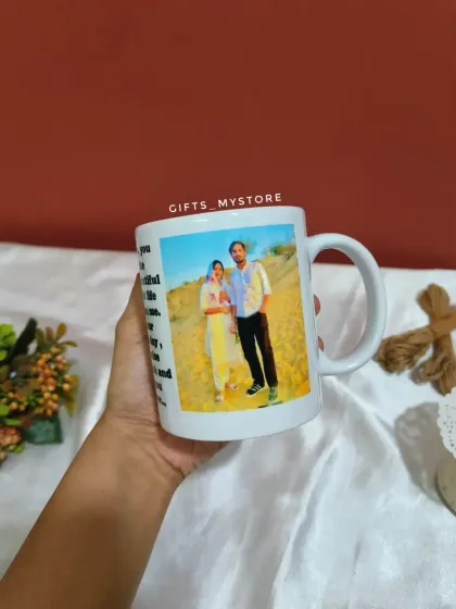 The custom photo mug, featuring a picture of the couple and a heartfelt message on the other side.