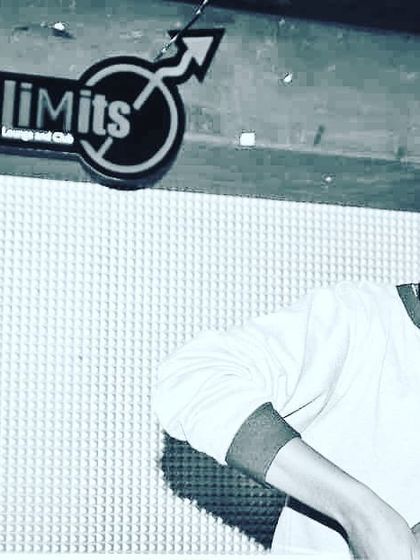 A black and white shot from a night at NoLimits Lounge and Club. This captures the focused, classic vibe of spinning records in a dedicated music venue.