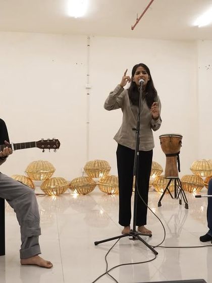 An acoustic trio from our Seekho Showcase 4.0, featuring a vocalist, guitarist, and a percussionist on the cajon. This simple setup highlights the raw talent of our musicians.