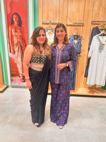 Posing with a client who chose a gorgeous black pre-draped saree during my styling session at Global Desi.