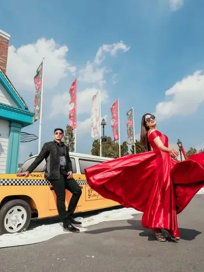 Our red satin A-line gown has a beautiful flow and movement, perfect for creating dynamic shots. It's a classic and elegant choice for a variety of photoshoot themes.