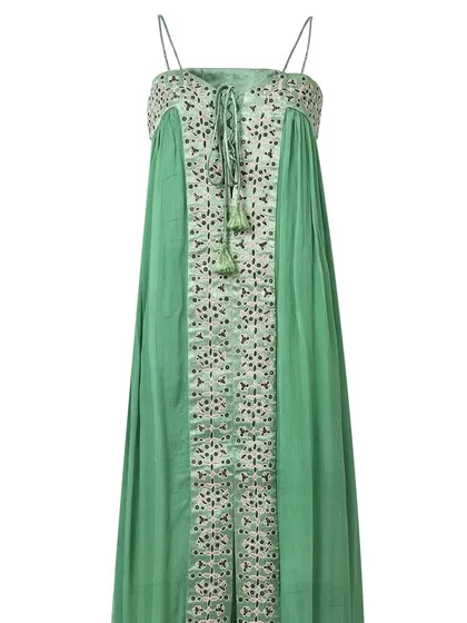The front view of a green spaghetti-strap maxi dress with intricate embroidery, shot on a white background to emphasize the garment's details and silhouette.