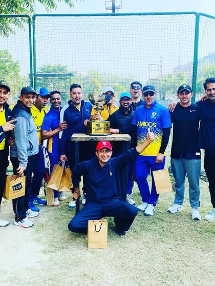 The full Amigos team posing with their trophy after being crowned champions.