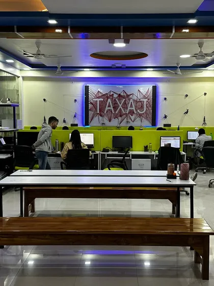 A glimpse into our new workspace where our team collaborates to manage your compliance needs. We've created a modern and energetic environment to foster innovation and deliver the best service to you.