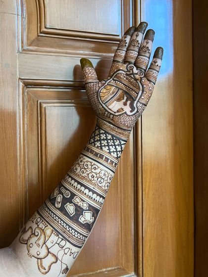 A single-arm view, showing the detail of the mother and baby portrait in the palm and the "Daddy" text on the forearm.