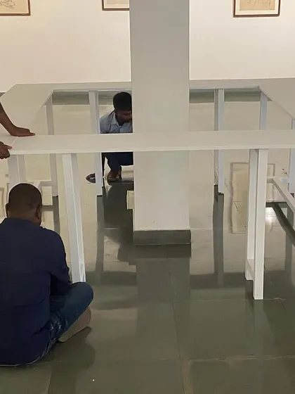My team assembling the custom display tables for Mohit Mahato's exhibition. Every element of the gallery design is carefully considered.