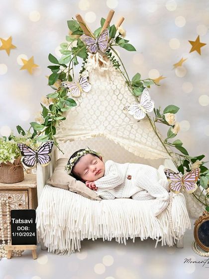 A dreamy butterfly-themed portrait for Children's Day. This little girl sleeps in a miniature tent adorned with butterflies and stars.