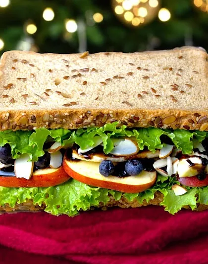 Another festive creation for the holiday season, this sandwich is packed with fresh veggies, fruits, and a delicious dressing, all on multigrain bread.