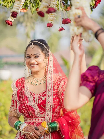 A candid moment during the wedding ceremony. The bride's smile is the best accessory.
